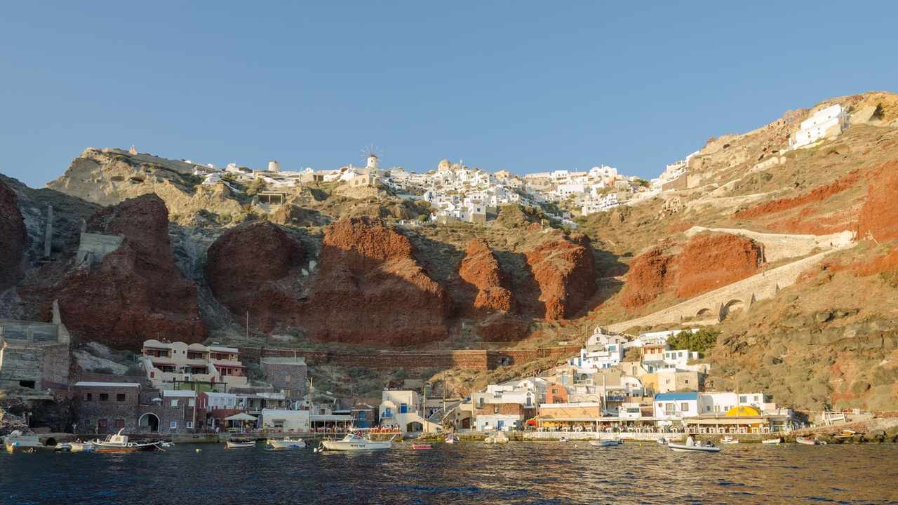 Whitewashed houses and blue domes of Oia above the caldera, Santorini, Greece