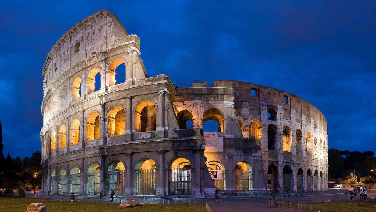 Colosseum in Rome at dusk — Italy country profile hero image